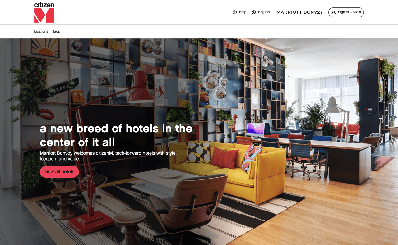 citizenM hotel homepage hero section, colourful modern lobby interior stock photo, site navigation with Marriott Bonvoy login, brand headline and view all hotels CTA button