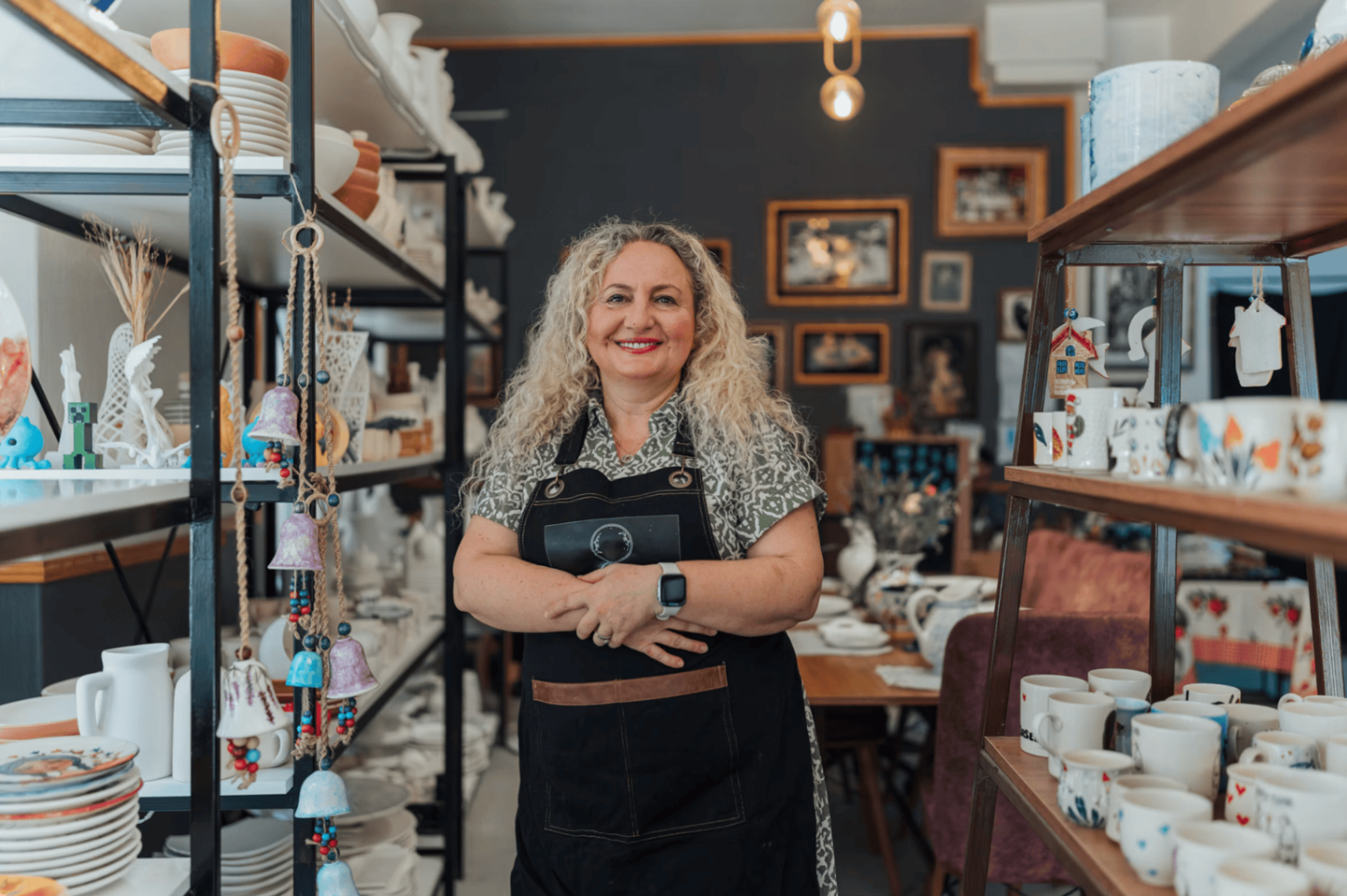 Small business owner smiling in her store