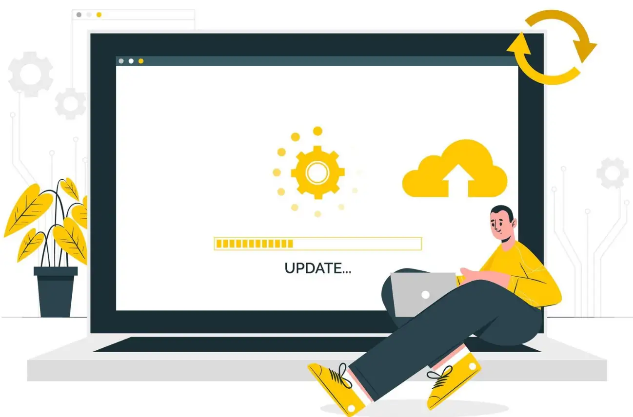 A man updating his website on a laptop