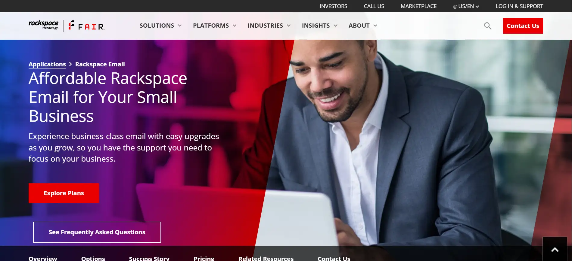 rackspace homepage featuring a man simling and working on laptop