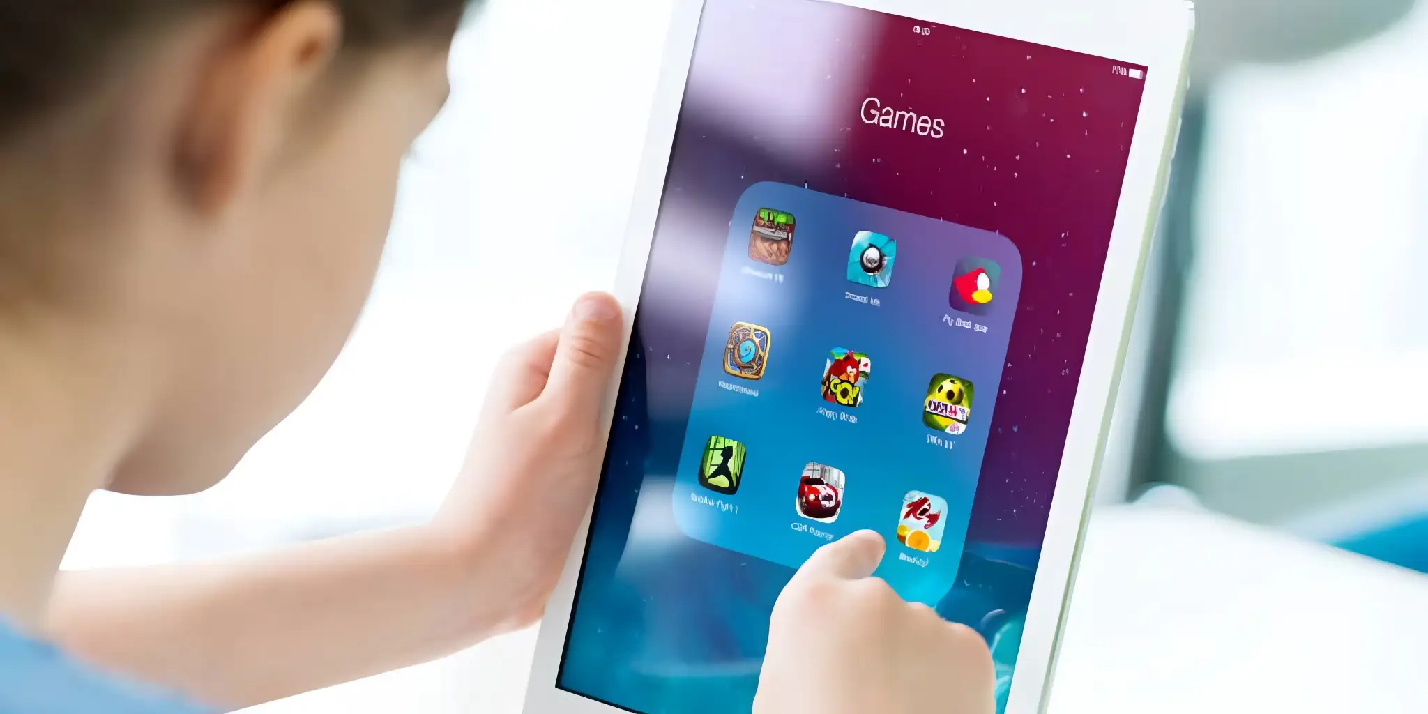 a person clicks on a game app on an ipad