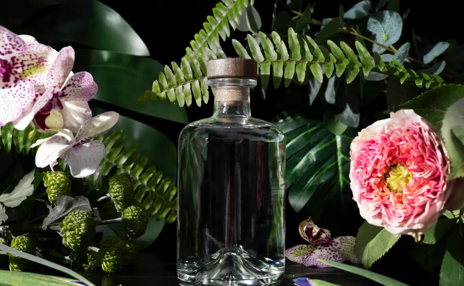 A perfume bottle in the centre of flowers