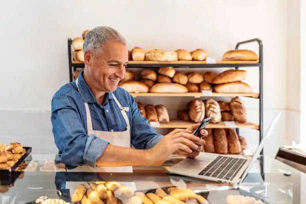Planning and building a professional bakery web page with delicious baked goods and a laptop. Planning and building a professional bakery web page with delicious baked goods and a laptop.