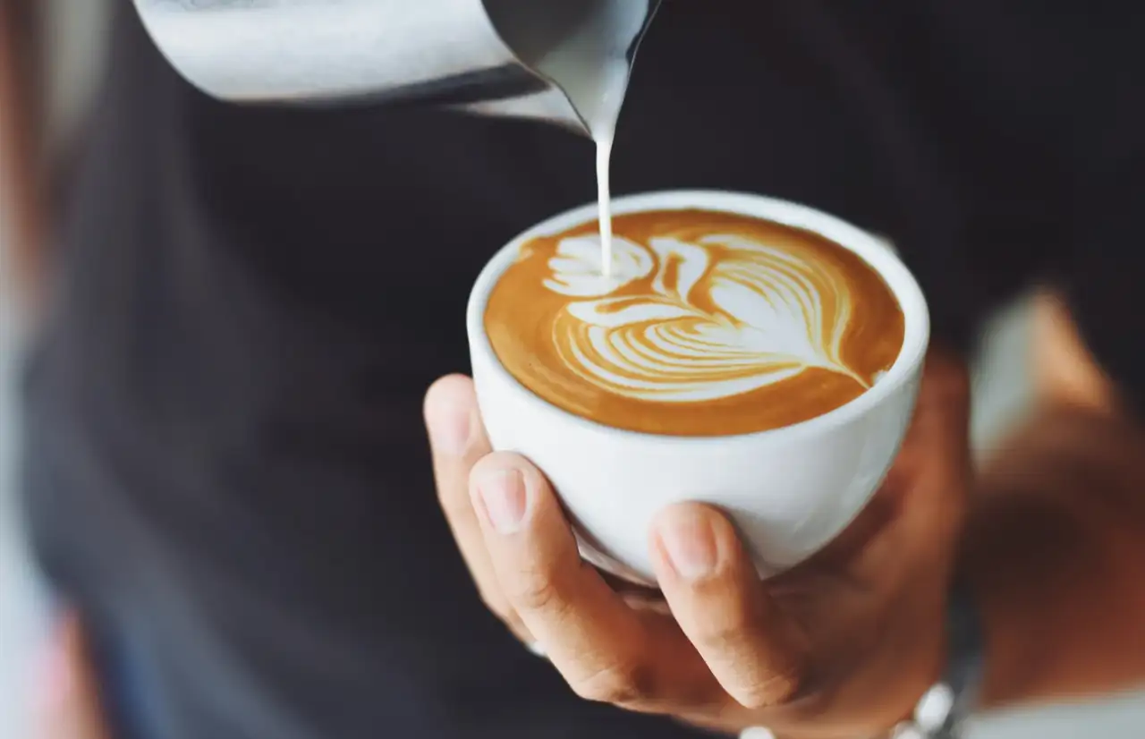 people making a cup of coffee