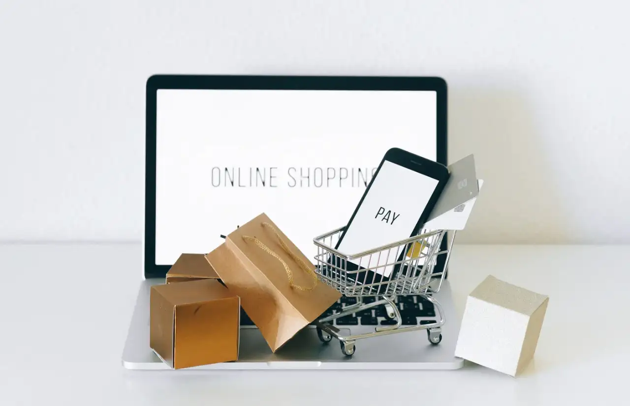 mini shopping cart in front of a desktop
