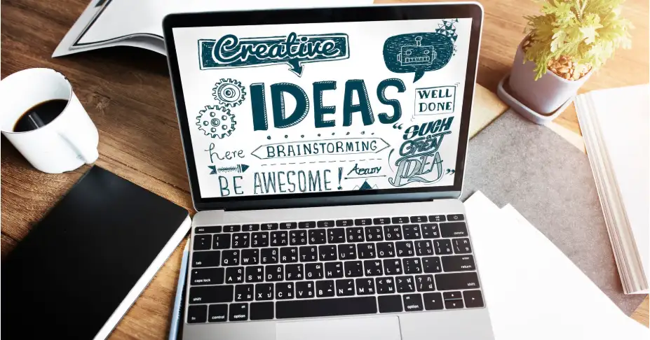 Laptop screen displaying "Creative Ideas" word cloud. Laptop screen displaying "Creative Ideas" word cloud.