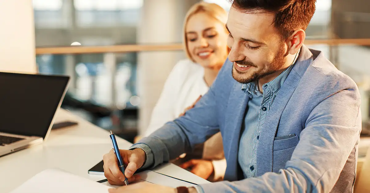 A team of entrepreneurs brainstorming their business vision on a whiteboard, showcasing one of the key traits of a successful entrepreneur. A team of entrepreneurs brainstorming their business vision on a whiteboard, showcasing one of the key traits of a successful entrepreneur.