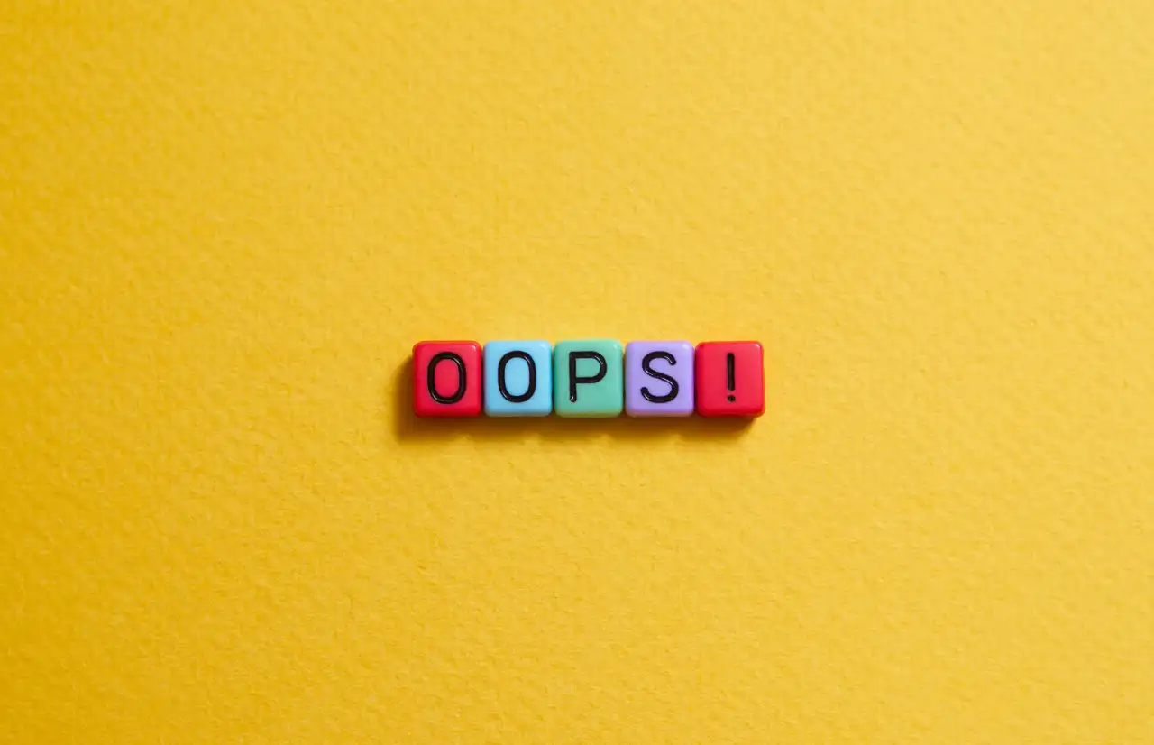 "oops" inside and yellow background