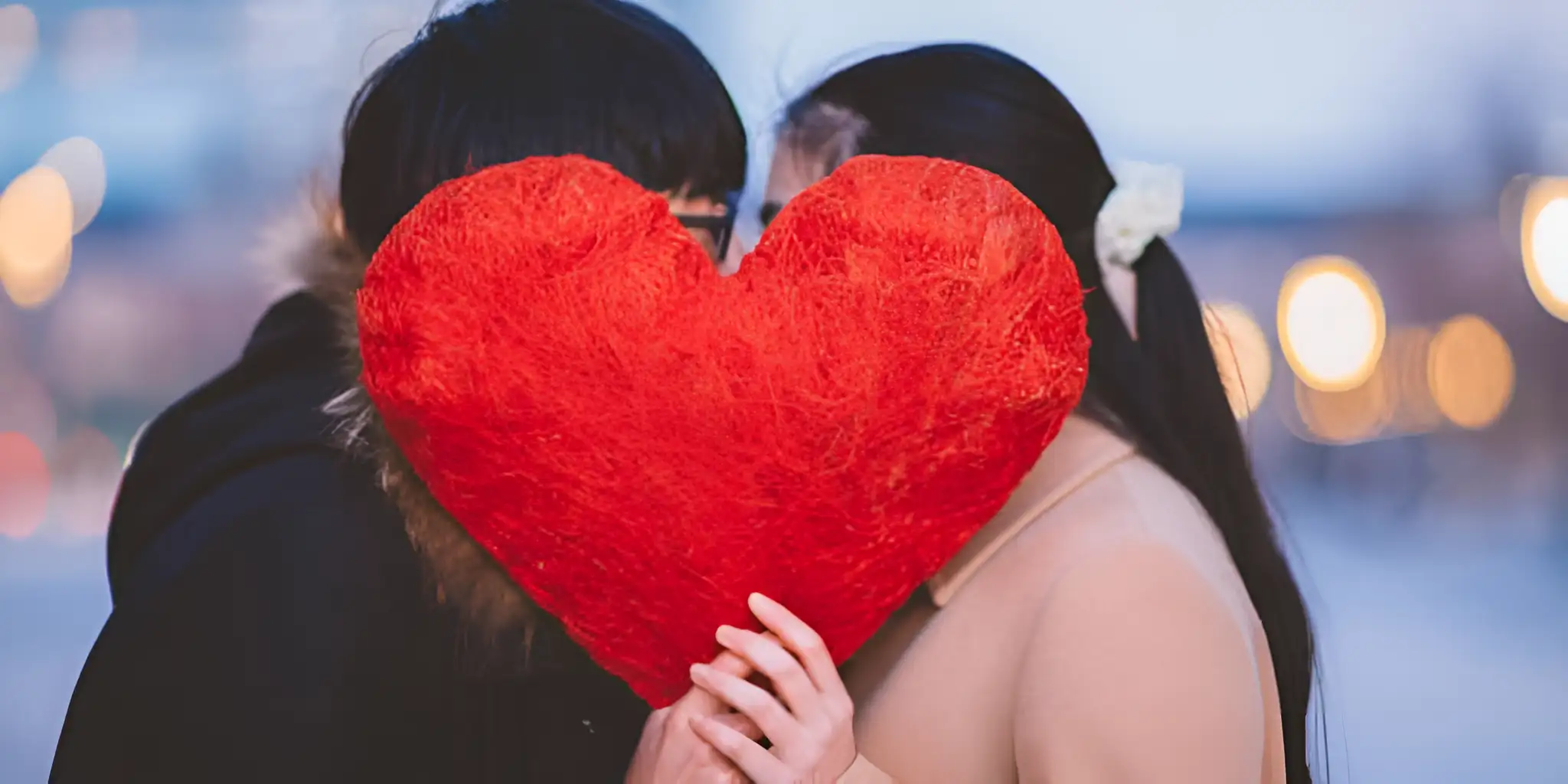 a group of couples holding love signs