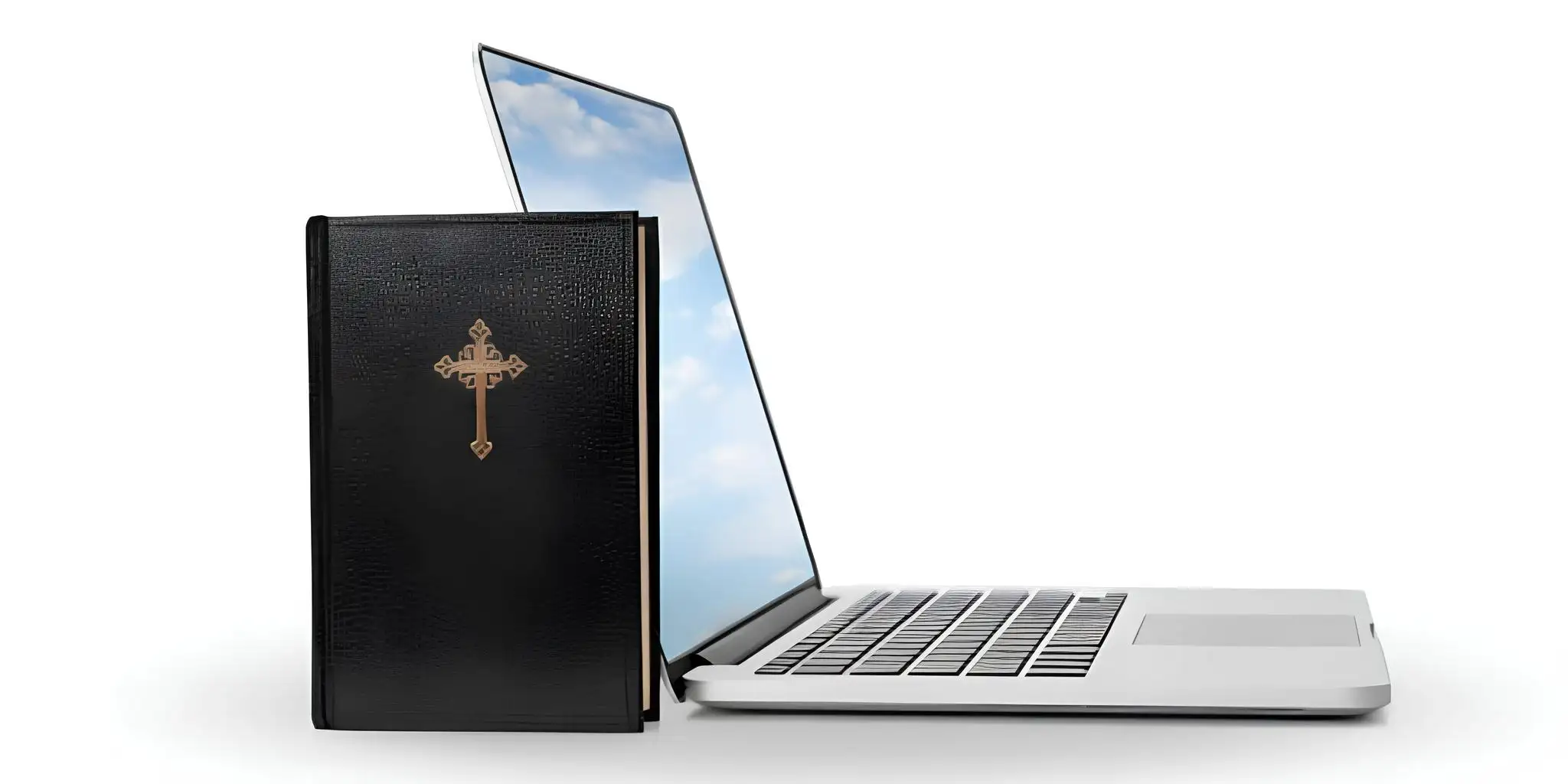 a church book next to a computer
