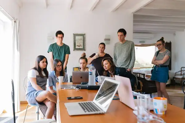 group of people sitting together to solve domain problems