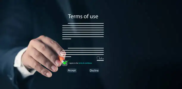 person in suit touching virtual accept button on agreement