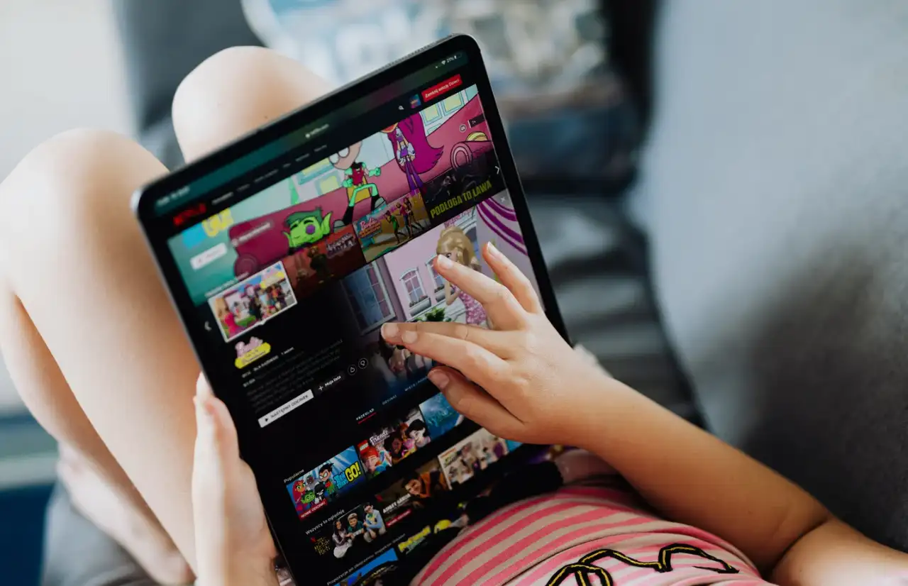 girl watching netflix anime series on ipad