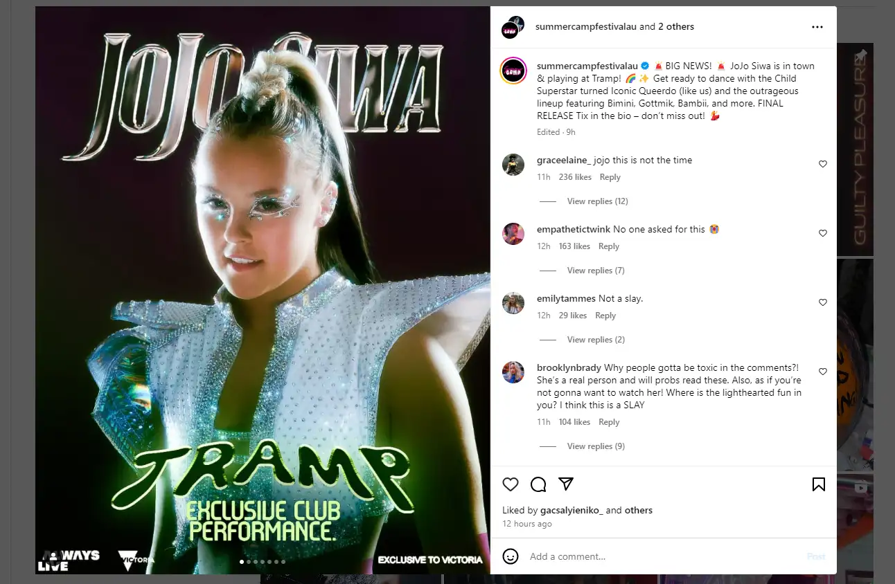 person in sparkly outfit with jojo siwa tramp sign