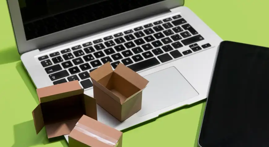 A computer and a pad with some empty express boxes