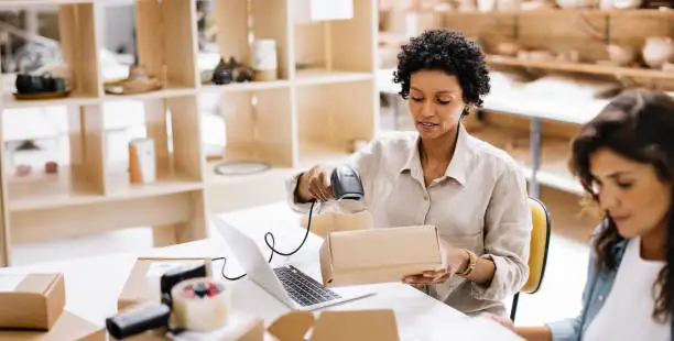 a woman scanning parcels for ecommerce