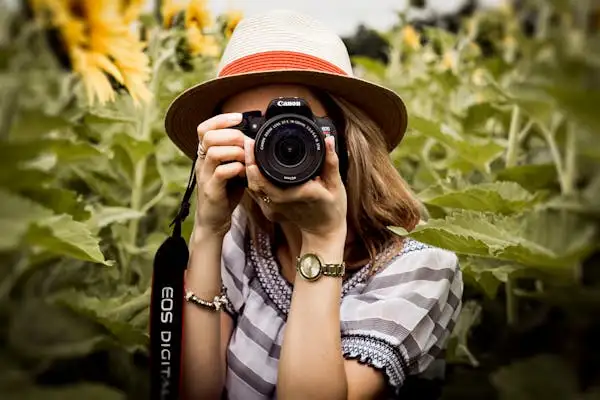 a woman is shooting with her camera