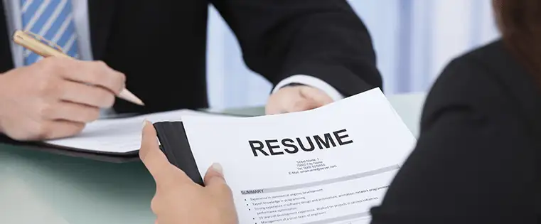 a girl is holding her one page resume in front of the interview