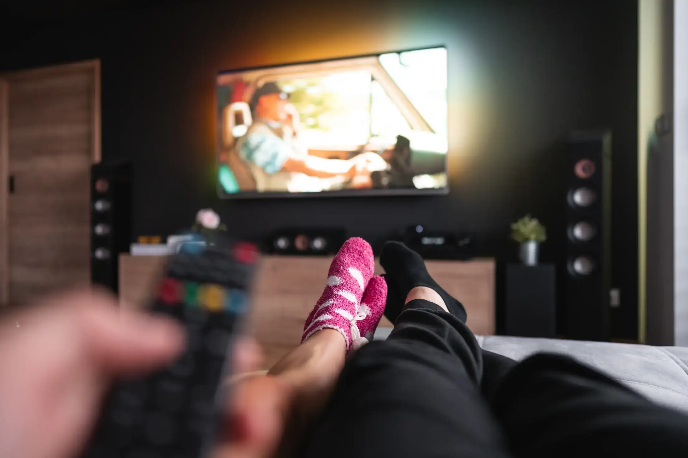 two persons safely enjoying a movie at home using one of the best free streaming services 2025. two persons safely enjoying a movie at home using one of the best free streaming services 2025.