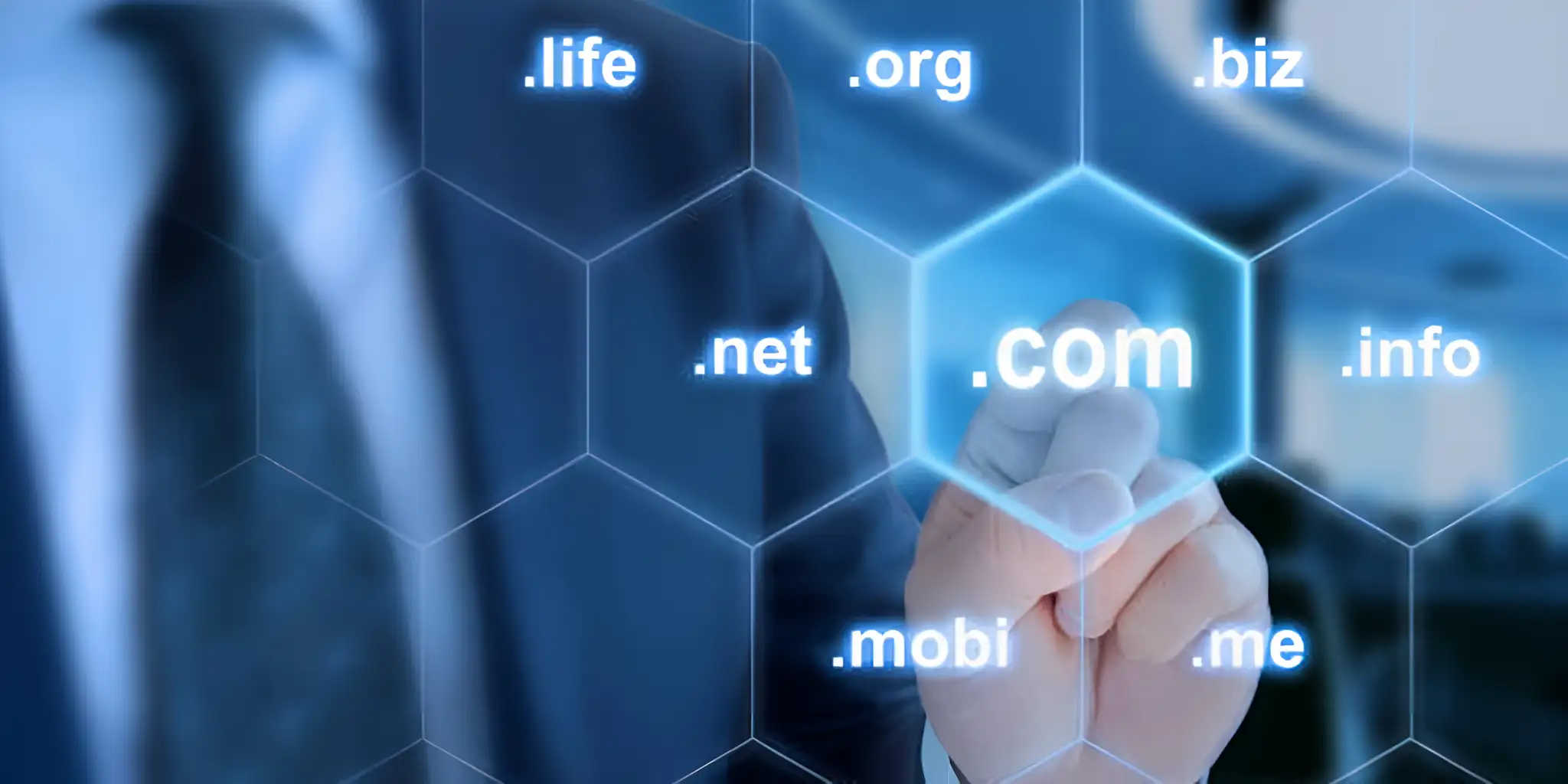 multiple website suffixes come together, and the finger touches the .com suffix