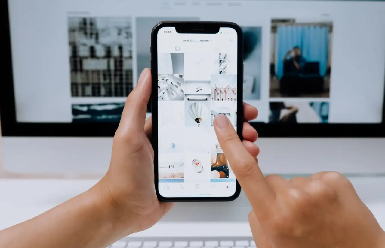 people viewing photos on a phone
