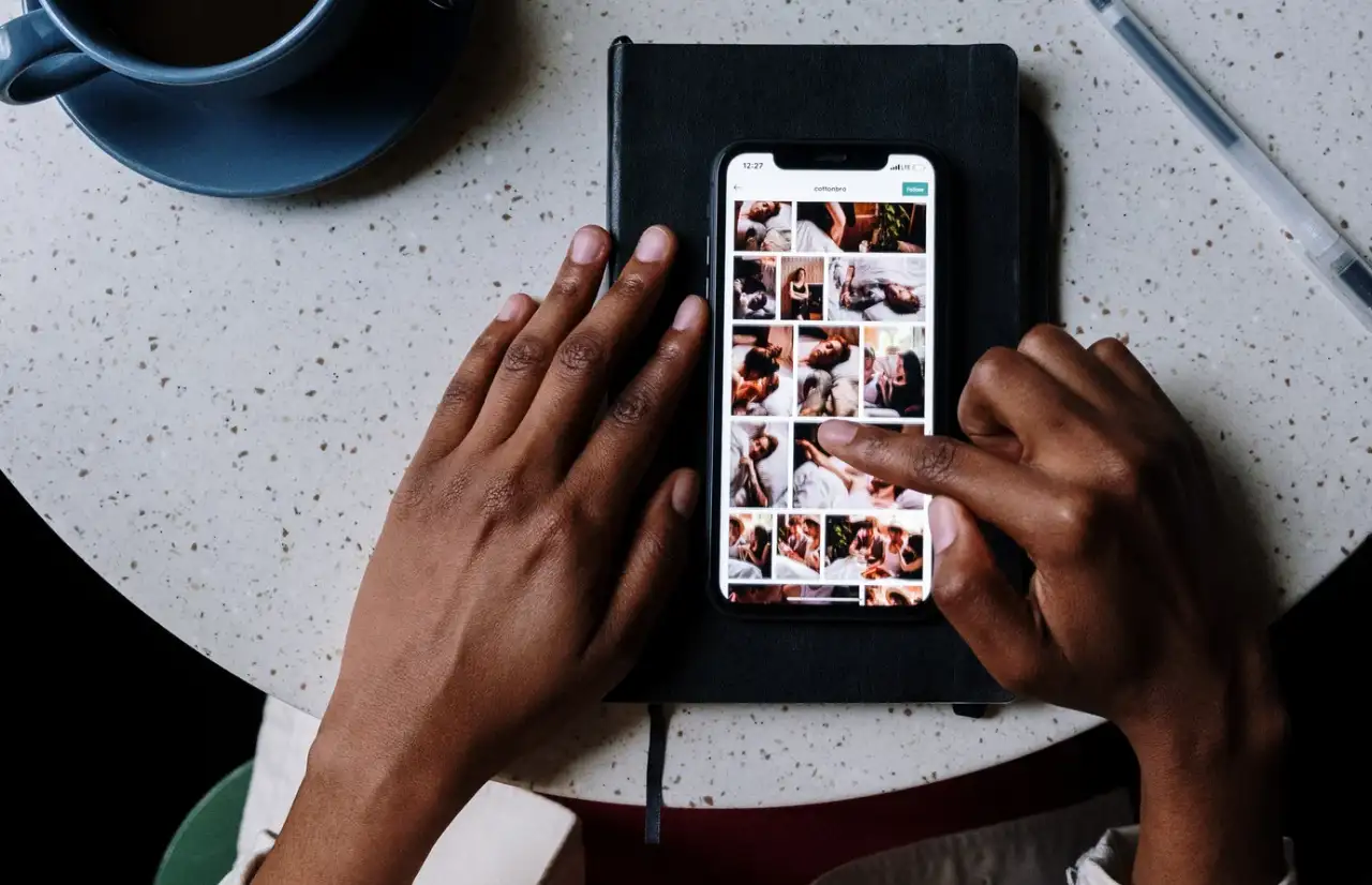 a man posting photos onto instagram