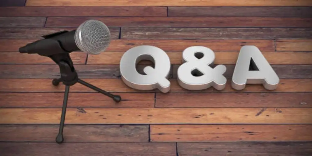 A microphone is placed next to the question and answer alphabet board