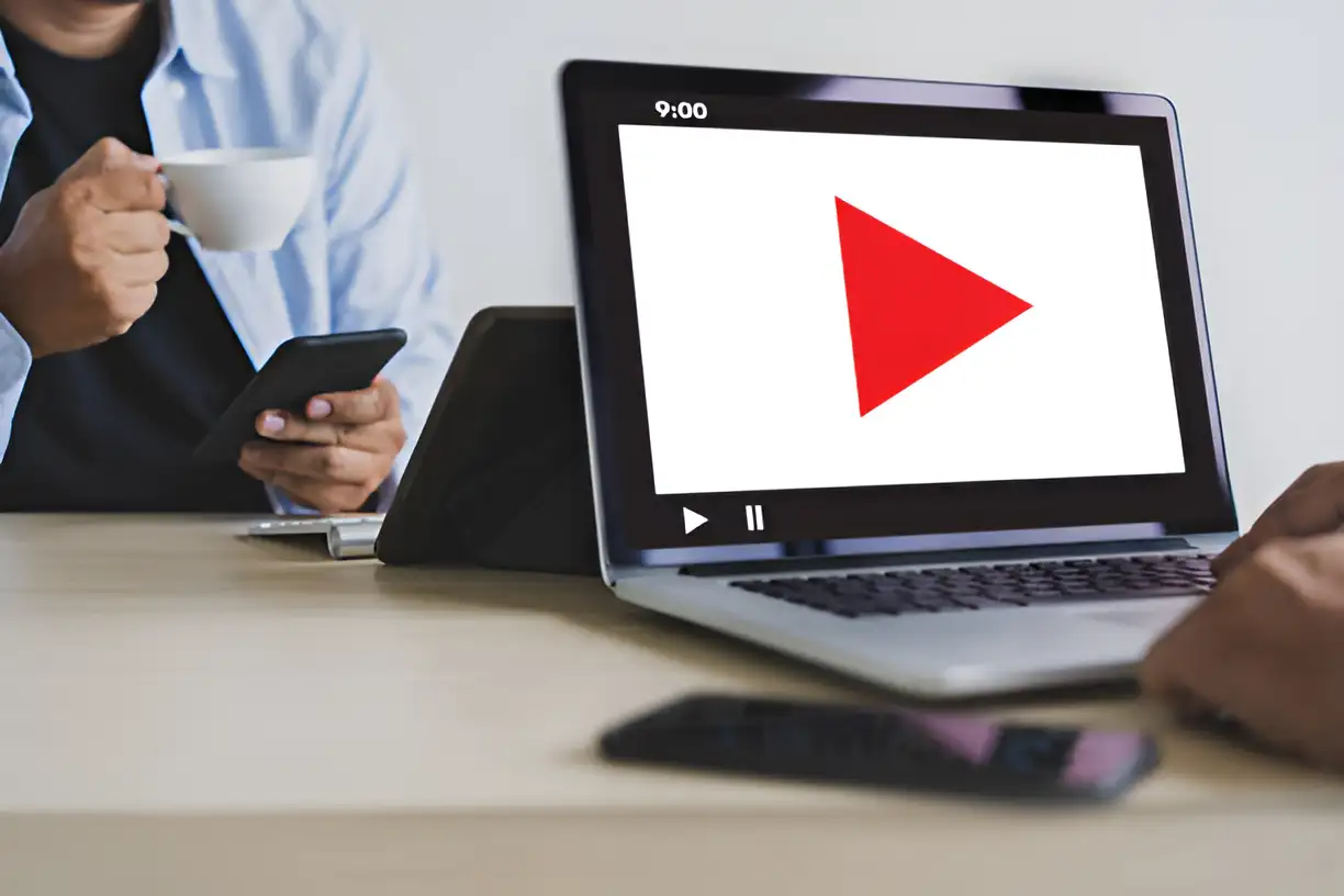 a person opens the youtube platform on a computer